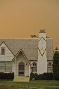 Foreboding skies linger behind a house in Omak, WA