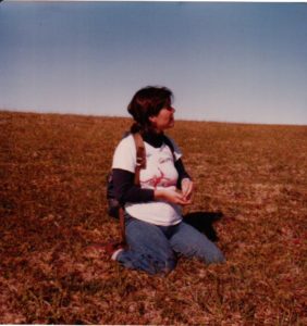 Jane picking blueberries on the tundra circa 1978